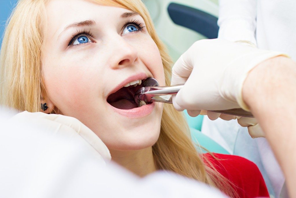 Patient's teeth being extracted