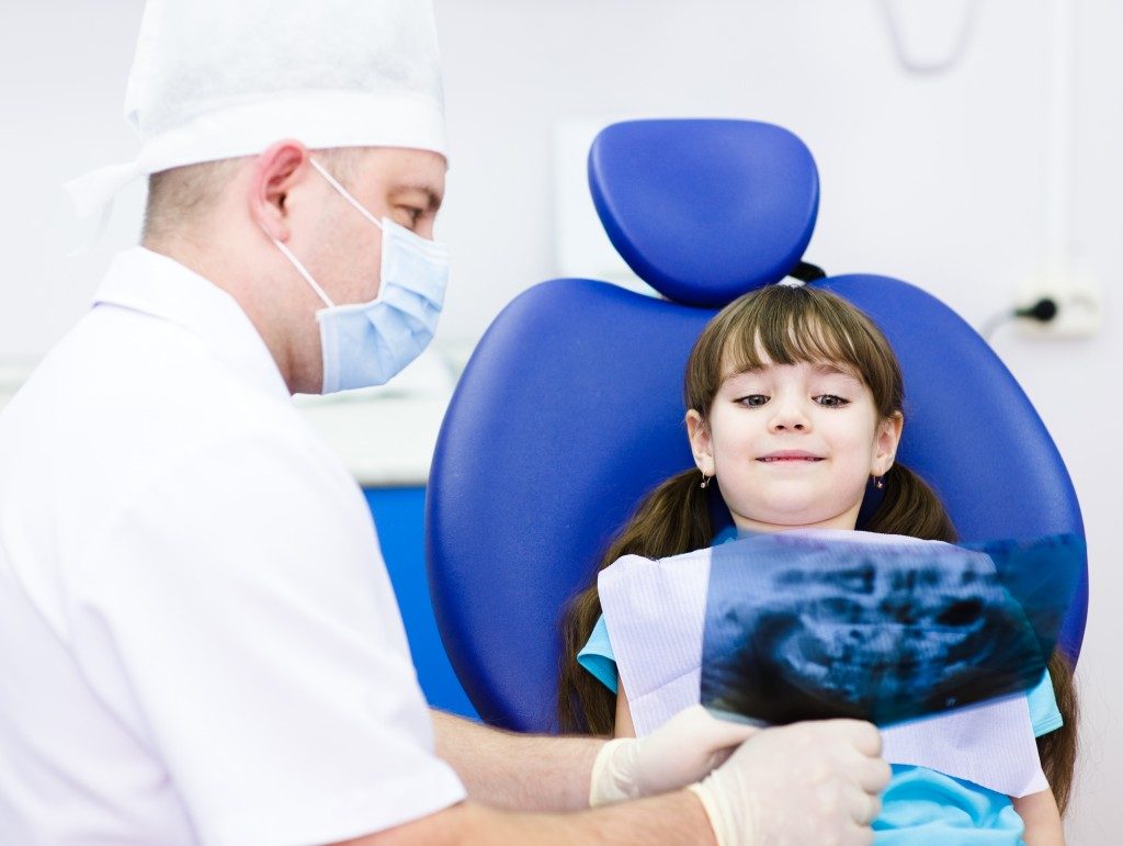 Young girl with the dentist