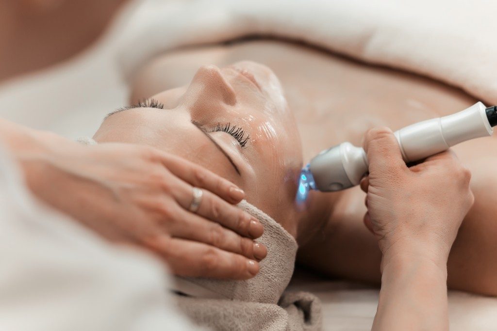 Woman getting skin treatment at a clinic