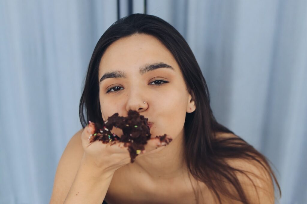 A Woman Eating Chocolate Cake