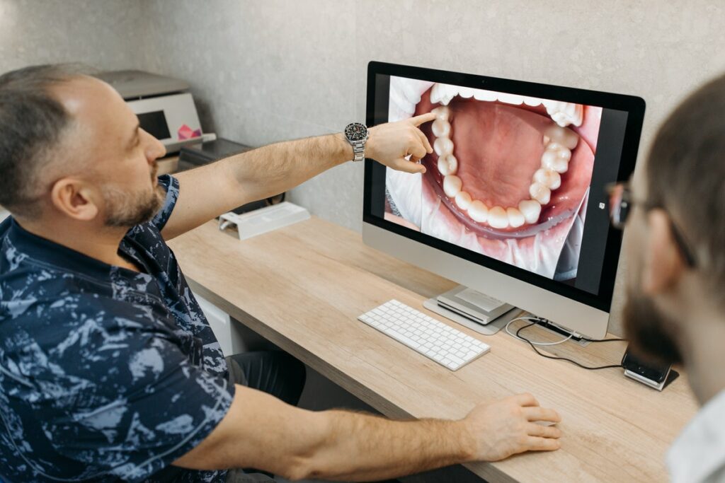 dentist having a client teeth check-up