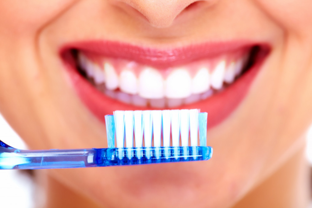beautiful woman with toothbrush closeup image
