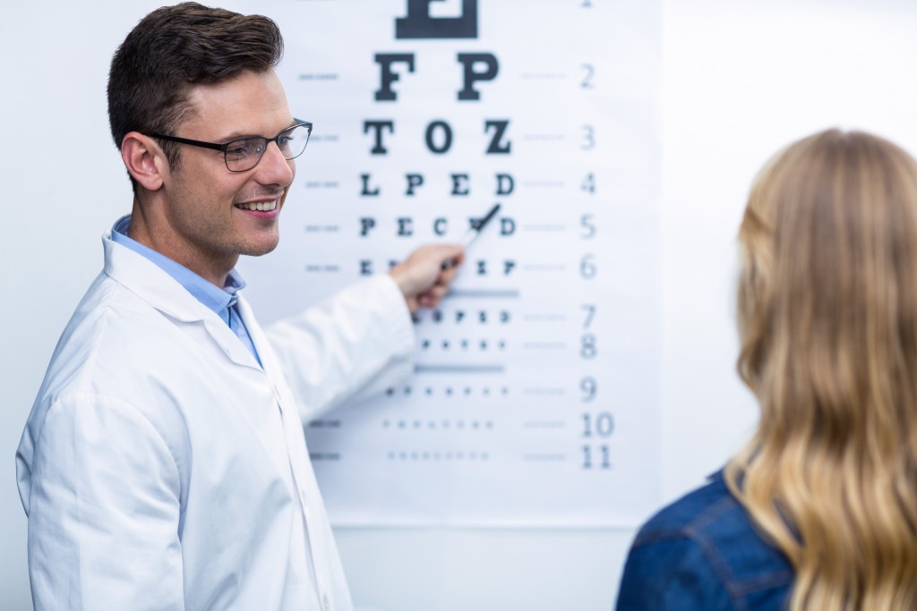 Optometrist with a patient