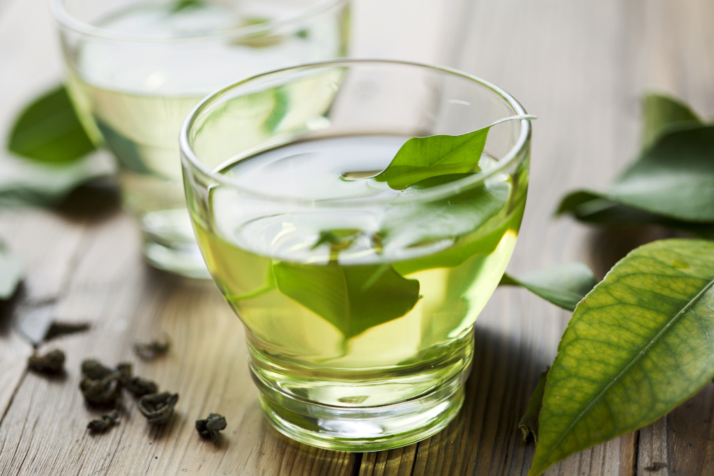 fresh green tea with green tea leaves