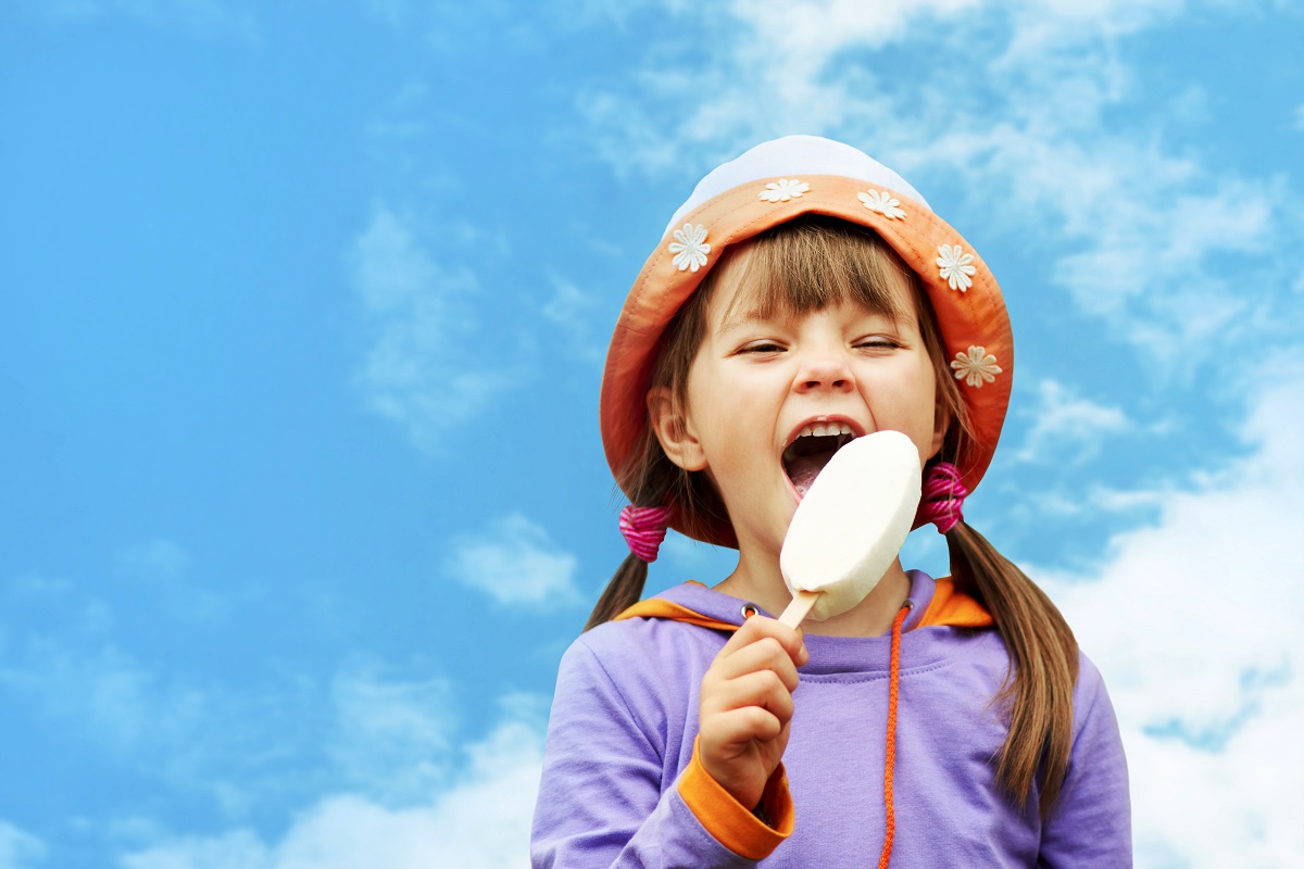 female kid eating ice cream