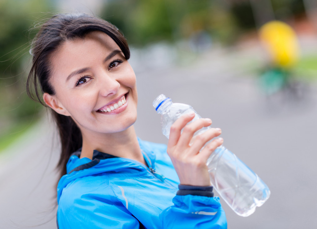 Woman holding a water bottle