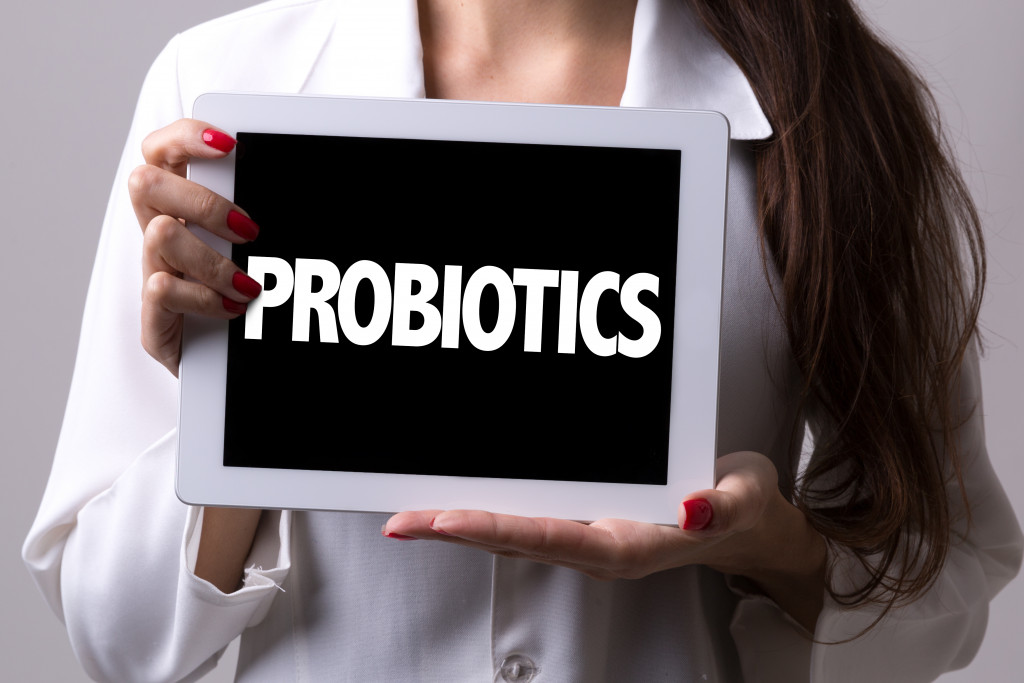 probiotics on tablet held by female doctor